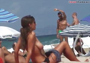 Great-looking hottie with huge melons spotted on the beach